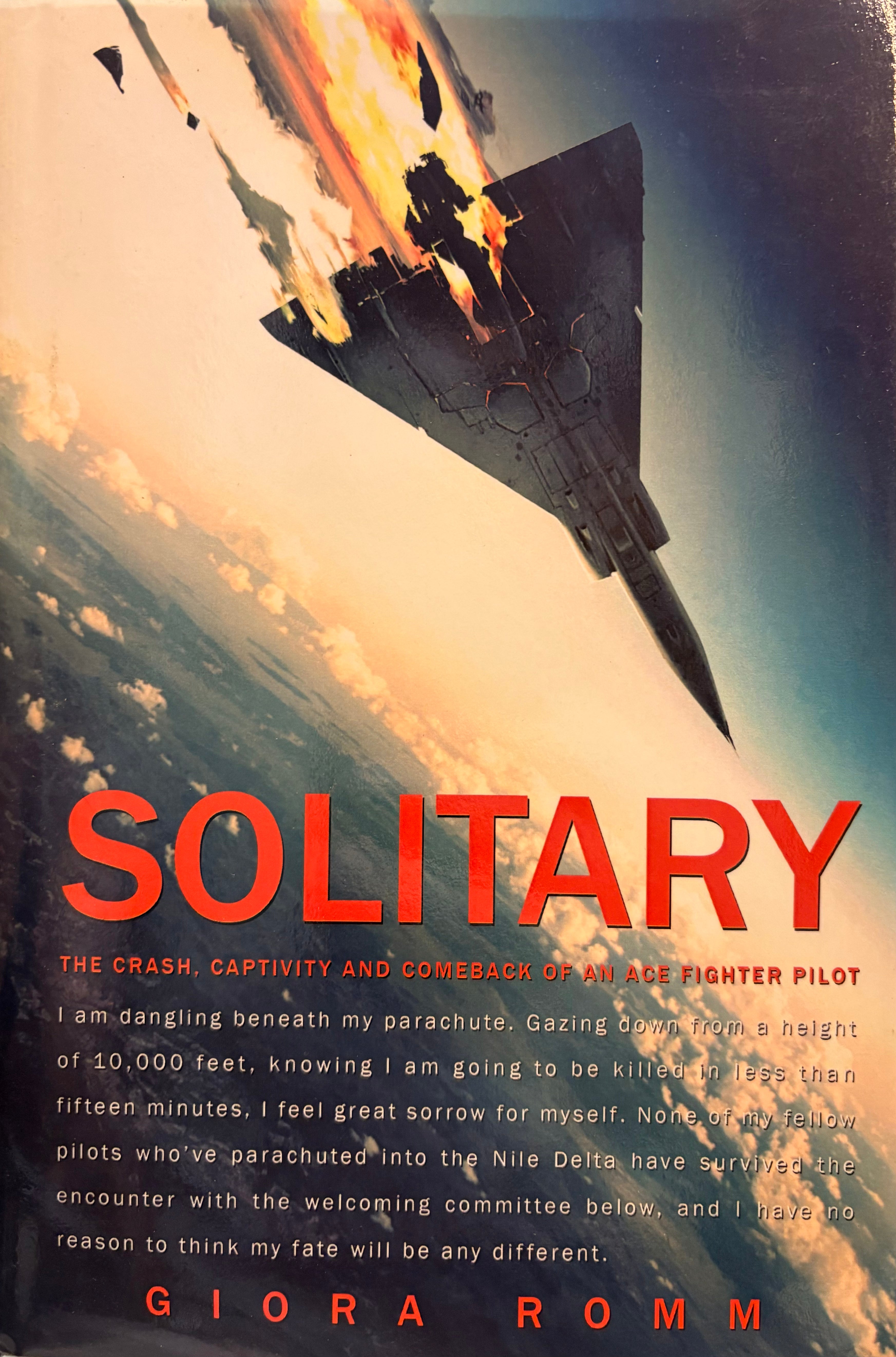 Solitary: The Crash, Captivity and Comevack of an Ace Fighter Pilot / By Giora Romm / עותק עם הקדשת המחבר למפקד חיל האויר